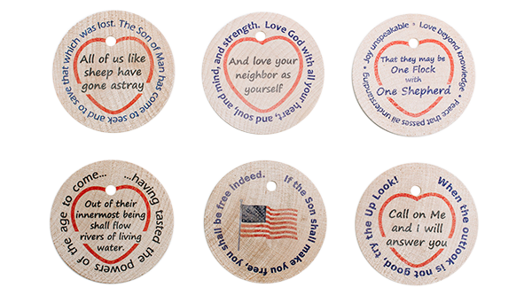 Wooden tokens with encouraging messages printed on them